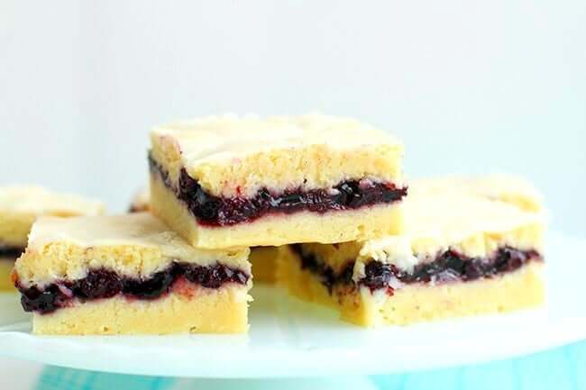 3 pieces stack of Blueberry Pie Bars in a white plate