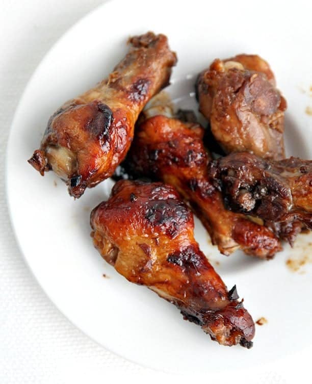 close up of Baked Honey Sesame Chicken Wings in white plate