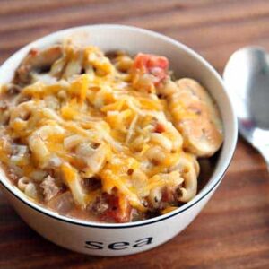 Cheesy Beef Skillet Dinner in a bowl with spoon on the side
