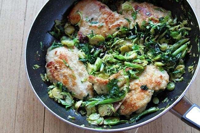 Chicken, Kale & Brussel Sprouts in Skillet with lemon dressing