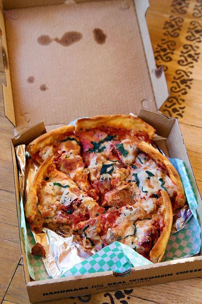 an open box of Oregano's Deep Dish Pizza