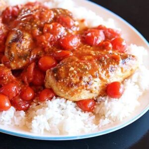 Smashed Tomato Chicken Served on top of Rice