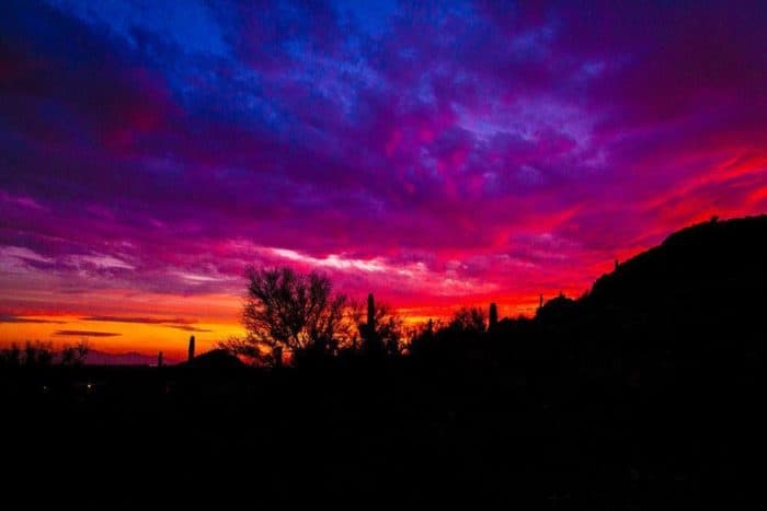 a view of Desert sunsets with the sky colored blue, violet and orange