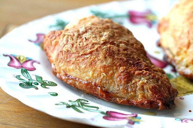 Crispy Oven Fried Chicken in a white plate with floral design