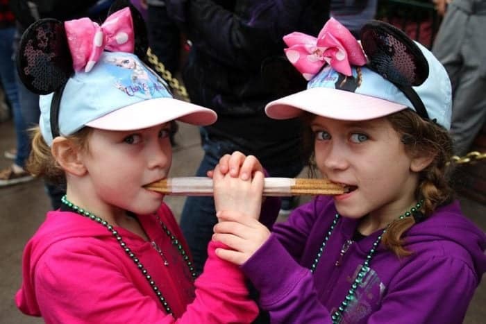 two young girls sharing Churros