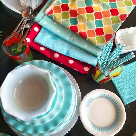 set of jade blue and white bowls, colorful photo props on the side