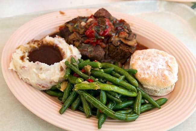 A plate of Pot Roast Beef with vegetables