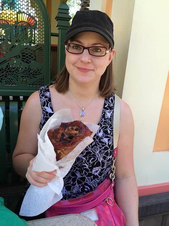 lady holding a wrapped Smoked Turkey Legs