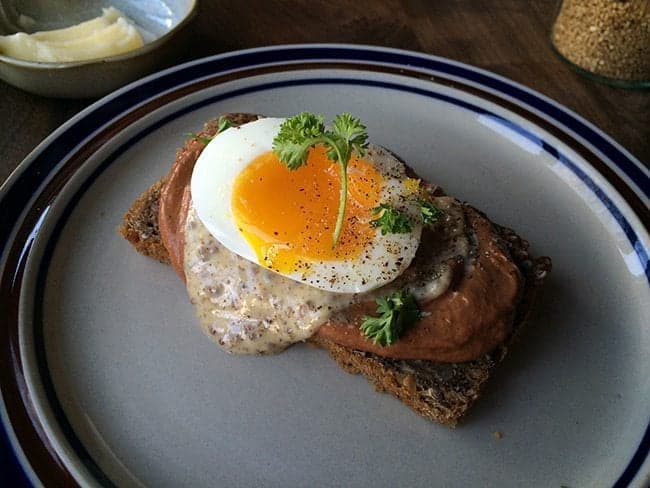 chicken liver pate with yolky egg in a plate