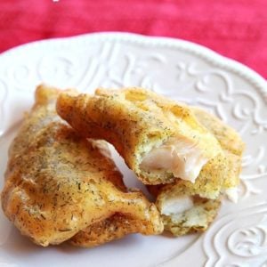 Deep Fried Haddock Recipe in white plate under red tablecloth