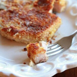 small crust from Panko Parmesan Pork Chop on a fork