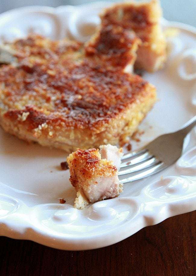 small crust from Panko Parmesan Pork Chop on a fork