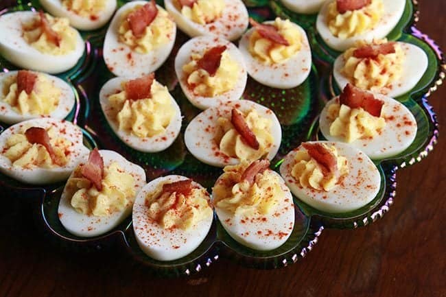 Smoky Bacon Deviled Eggs in a retro carnival glass deviled egg plate