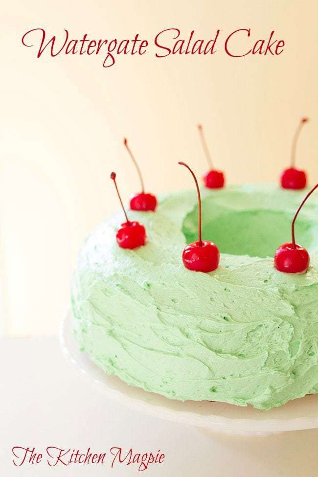 Close up of Watergate Salad Cake with frosting and cherries