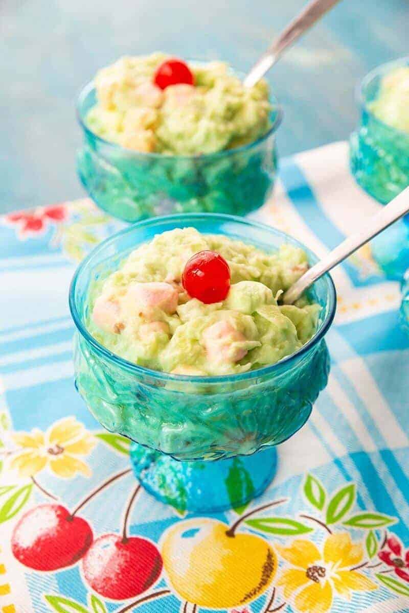 Watergate Salad topped with a maraschino cherry