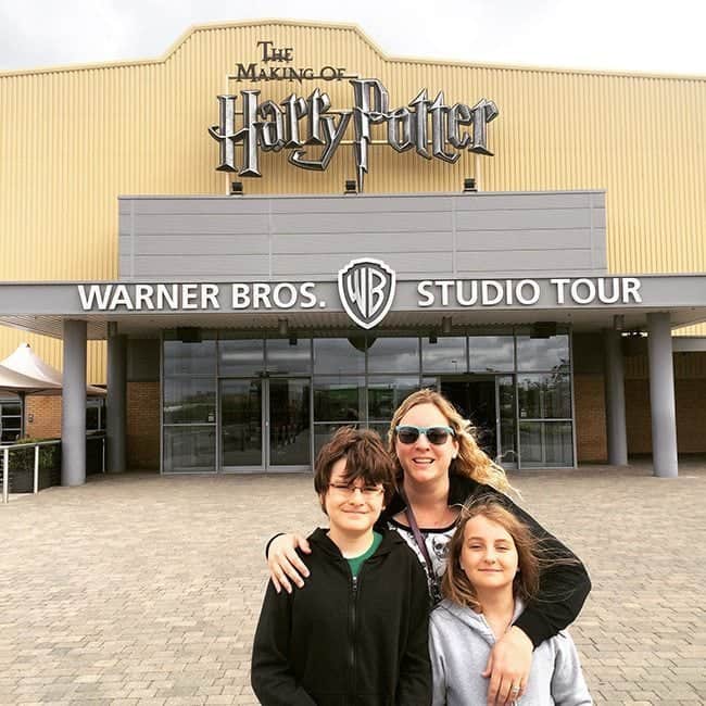 mother and kids in front of the Making of Harry Potter Studio