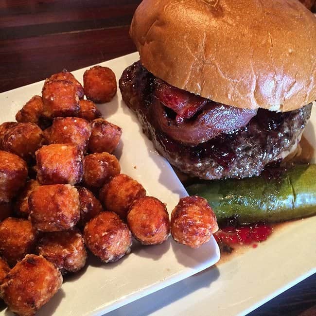 PBJ & Bacon Burger with sweet jam, salty bacon, rich peanut butter and hot sriracha sauce