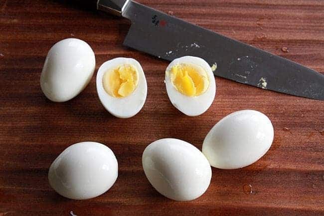 Perfect Hard Boiled Eggs and a knife on table