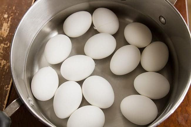 large pot with eggs and water ready for boiling