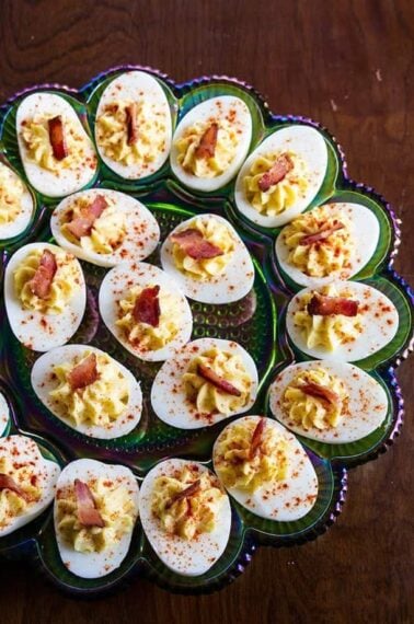 close up Bacon Deviled Eggs in a retro carnival glass deviled egg plate