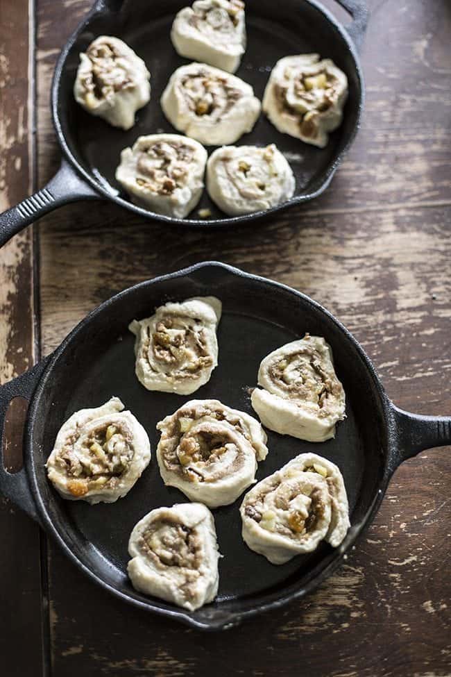 apple pie cinnamon buns in 2 well oiled cast iron skillets