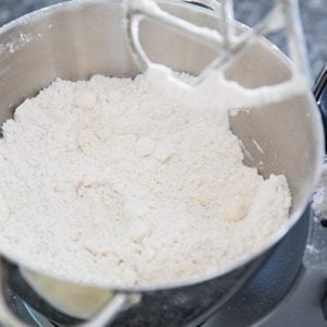 mixing bowl with flour and other ingredients for Christmas Cherry Scones