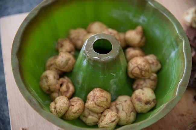 dough balls in a well-greased bundt pan