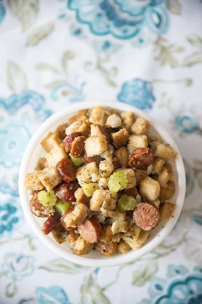 top down shot of Apple Sausage Crockpot Stuffing in a white bowl