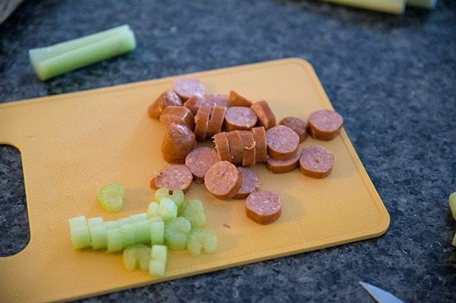 chopped up Johnsonville sausage and celery for Crock Pot Stuffing