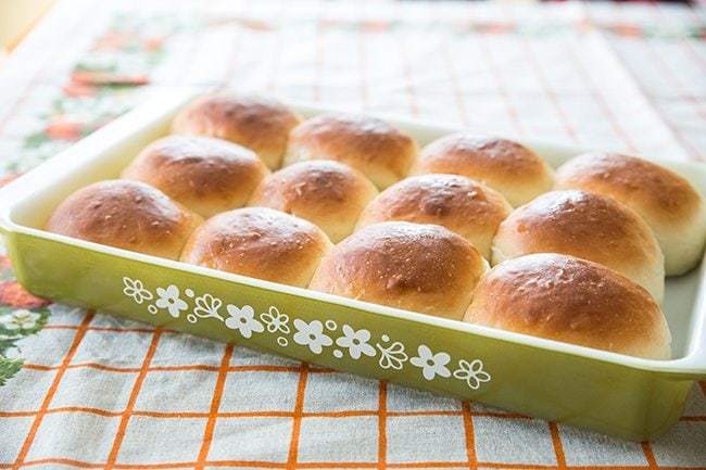 Close up of Old-Fashioned Southern Honey Butter Rolls in Pyrex baking pan