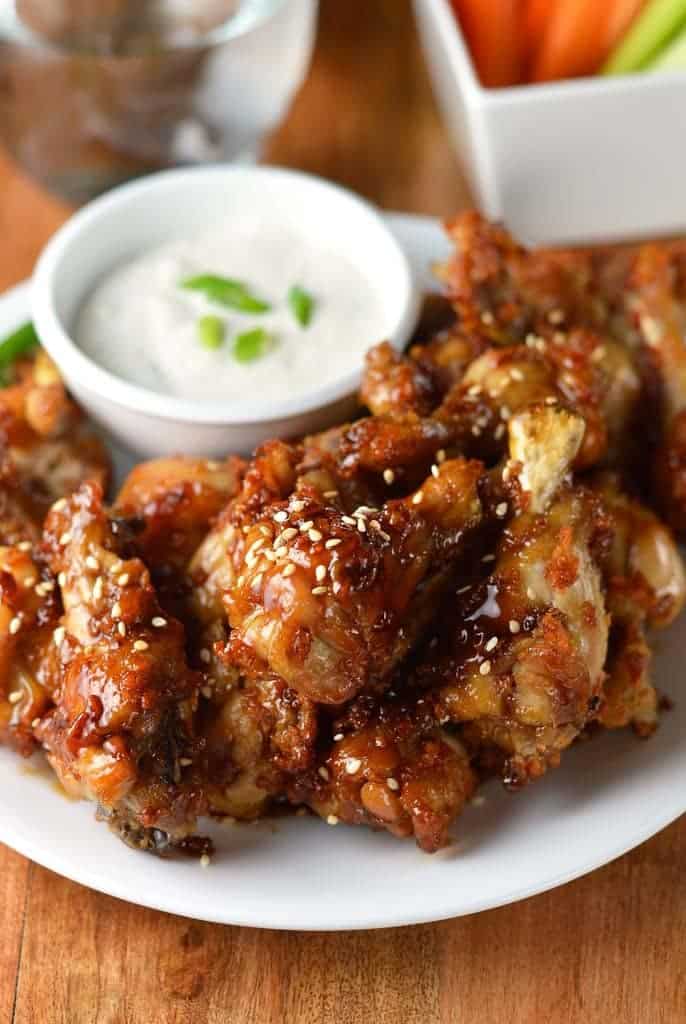 Sticky Chicken Wings Sesame and a dipping sauce on the side
