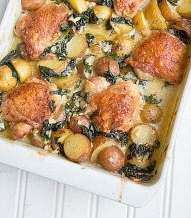 Creamy Garlic Parmesan Chicken & Potatoes in a White Baking Pan