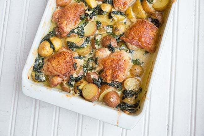Creamy Garlic Parmesan Chicken & Potatoes in a White Baking Pan