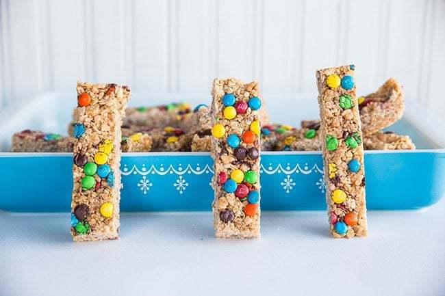 Slices of Homemade Granola Bars, blue Pyrex baking dish on the back