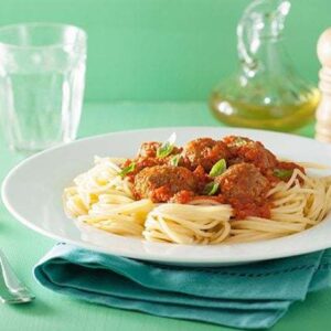 Meal Planning Made Easy - white plate with pasta topped with pre-made frozen meatballs.