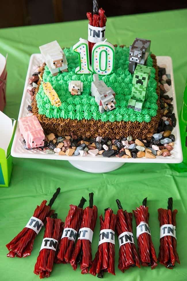 Minecraft Birthday Party Cake with Buttercream Icing, Minecraft plastic figurines and some chocolate rocks randomly around
