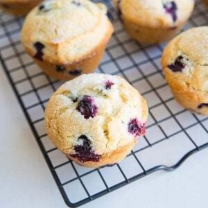 close up Bakery Style Blueberry Muffins in cooling rack