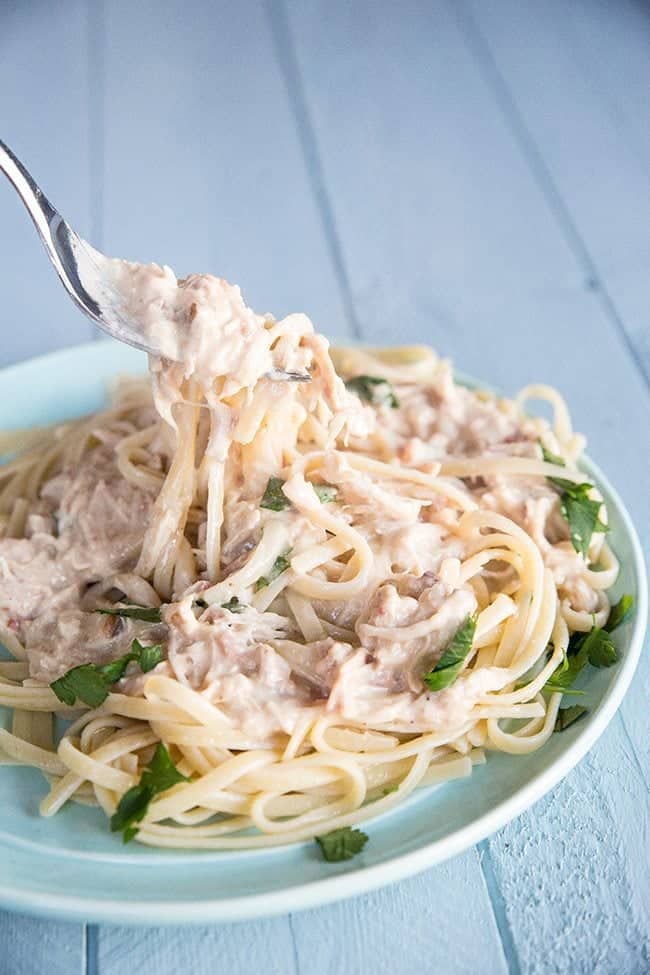 Getting some pasta from Gluten-Free Bacon Mushroom Ranch Crockpot Chicken using a Fork