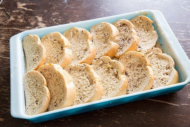 slices of bread overlapping each other in a baking pan