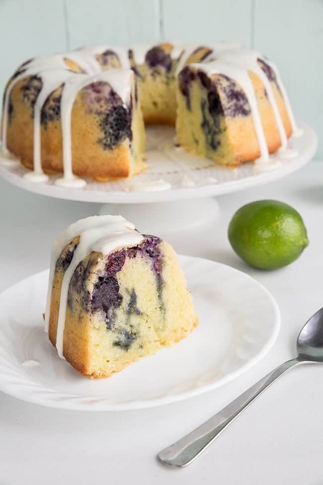 a slice of glazed Blueberry Lime Bundt Cake