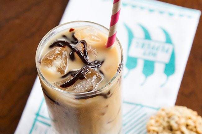 Top down shot of Boozy Bourbon Black Cow Drink with Chocolate Sauce on Top