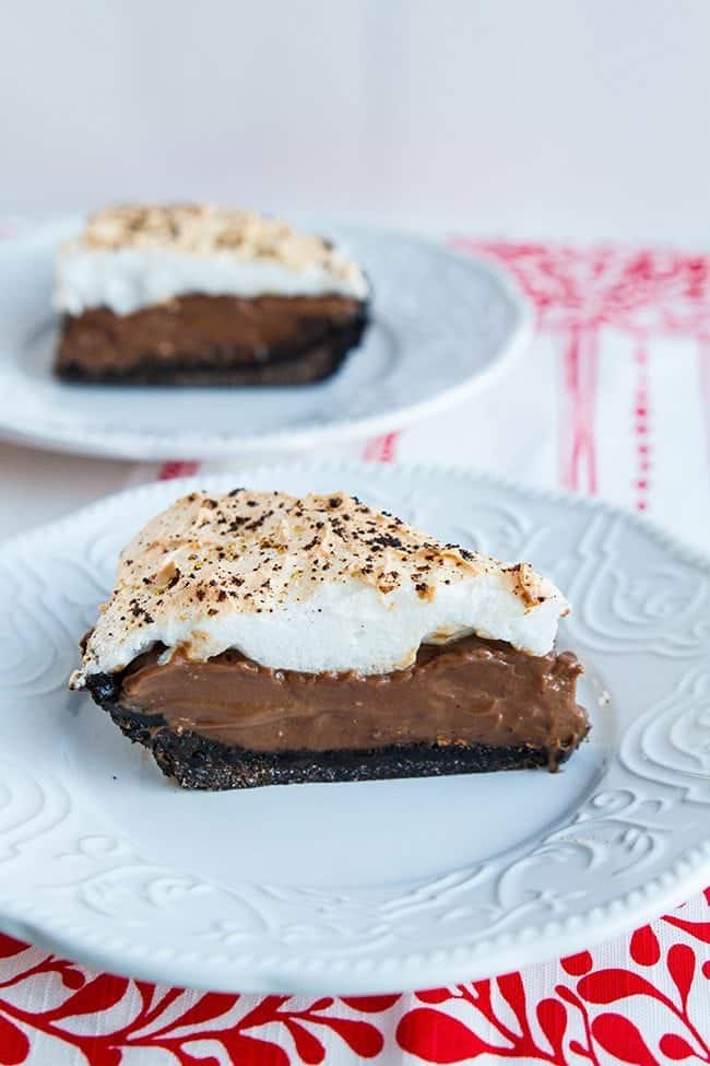 Slices of Chocolate Flapper Pie with graham cracker crust in white dessert plates