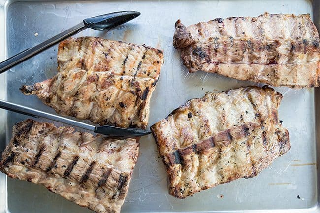 4 pieces of ribs placed on a lightly oiled baking sheet 