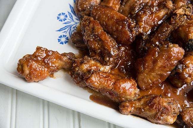 Japanese Chicken Wings with sauce in a white serving tray