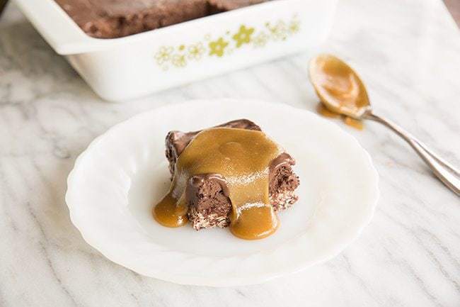  Vegan Caramel Chocolate Truffle Squares in a white plate on marble background