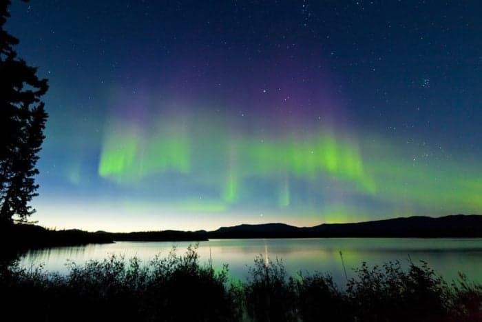 Dancing Northern lights Aurora borealis in summer 