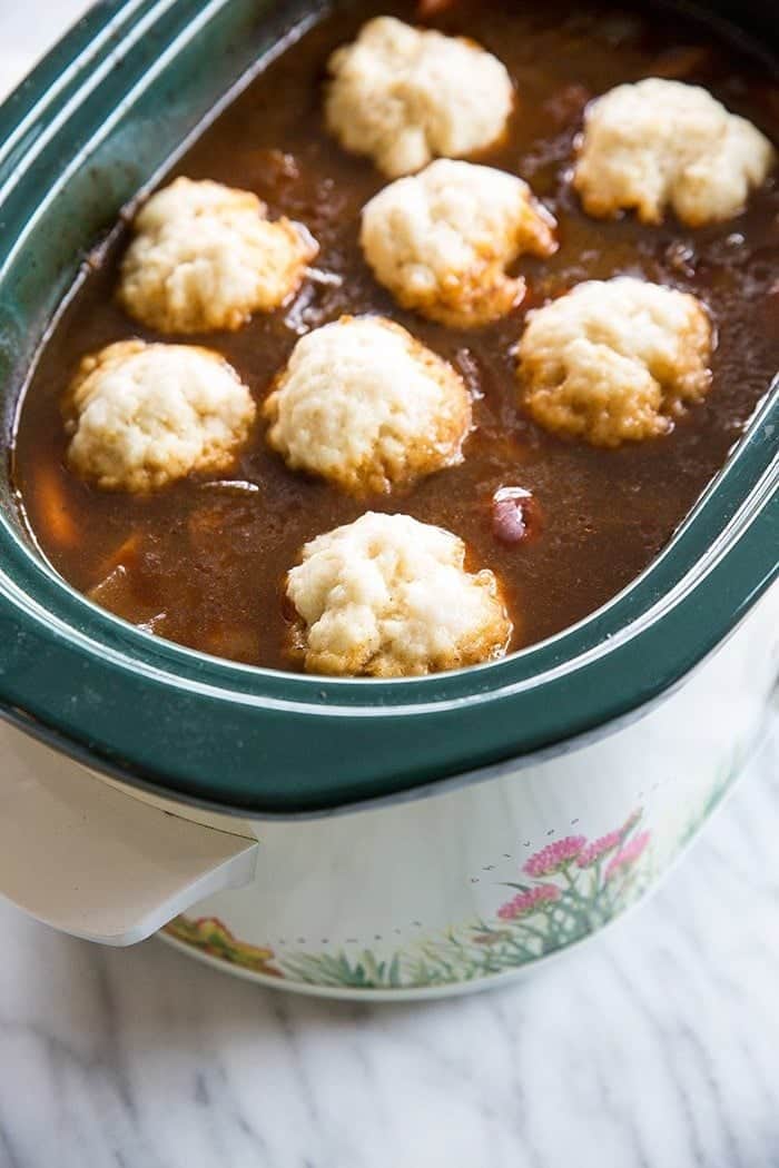 Crockpot soup with dumplings in a marble table