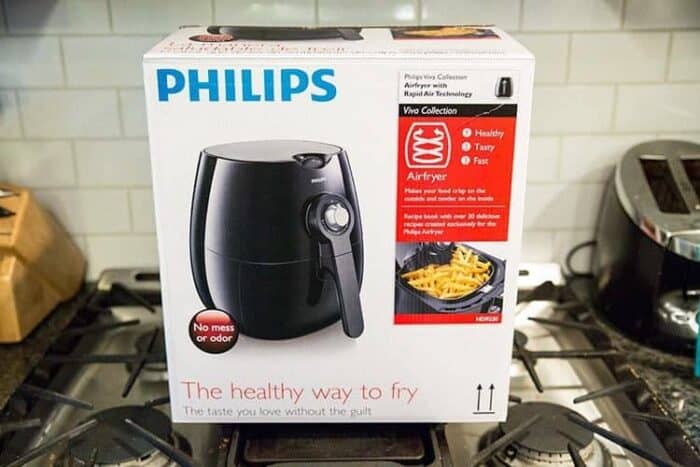 A box of Philips brand airfryer on top of stove