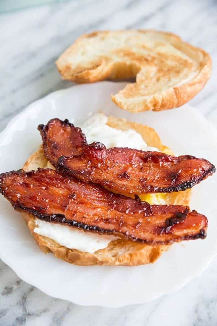 BBQ Glazed Bacon and Egg Croissants on white plate