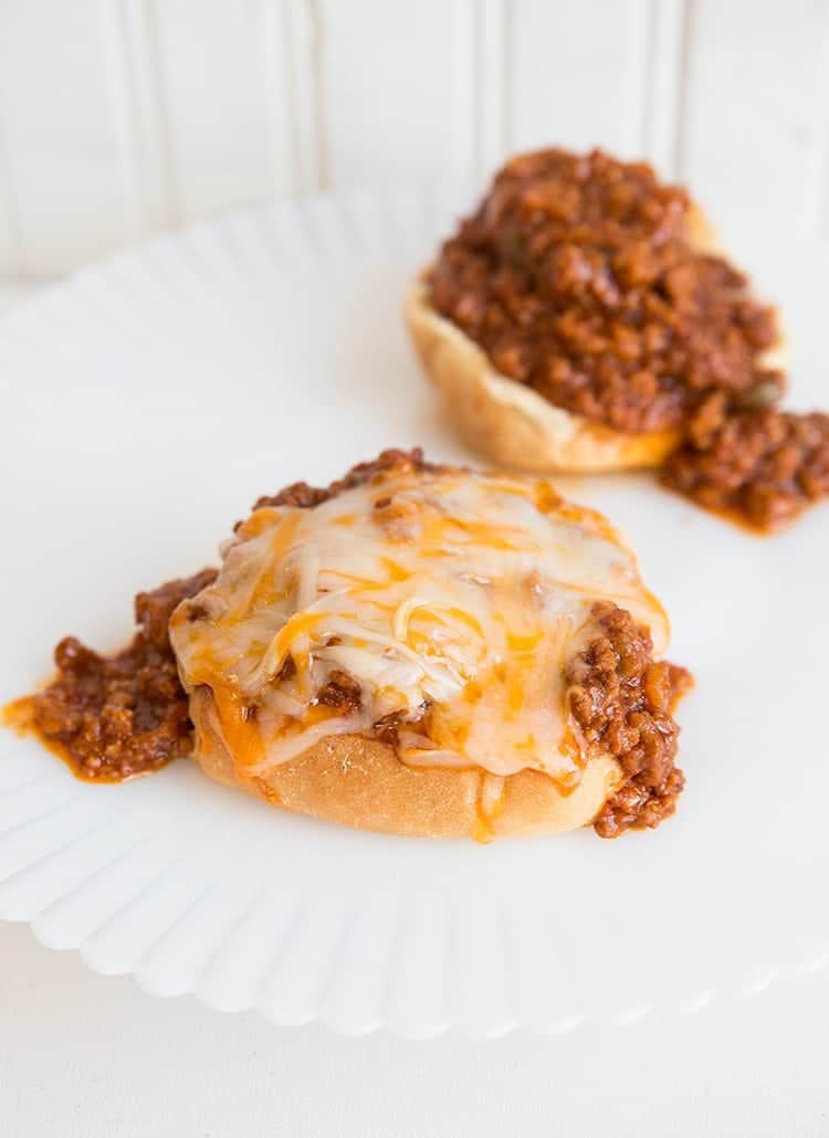 2 pieces of buns with Sloppy Joes and cheese on top